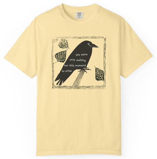 T-shirt with graphic image of a black bird on a perch with text of the Beatles' Blackbird lyrics.