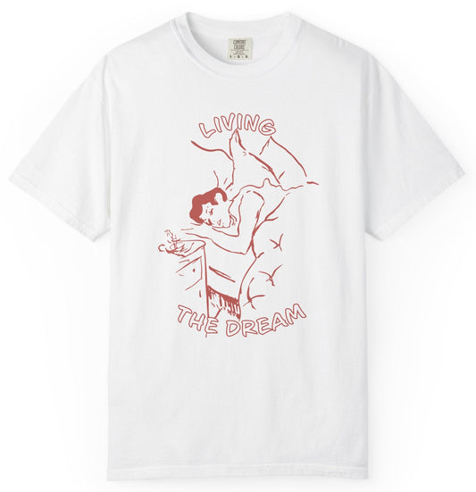 White t-shirt with red graphic and text 'Living the Dream' on a white background