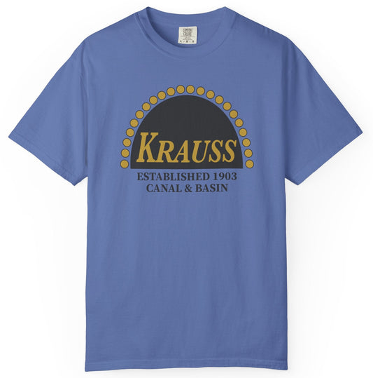 Blue t-shirt with 'Krauss' logo on a white background