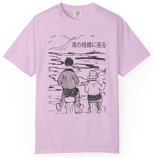 T-shirt with graphic of two boys facing the water with Japanese text