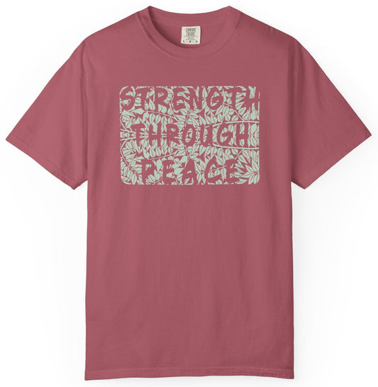 T-shirt with a green floral graphic and 'Strength Through Peace' text.