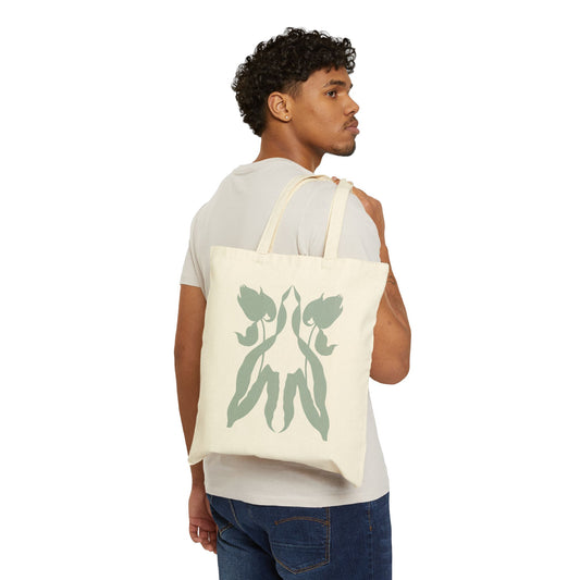 Canvas tote bag with a graphic of two tulips reflecting each other