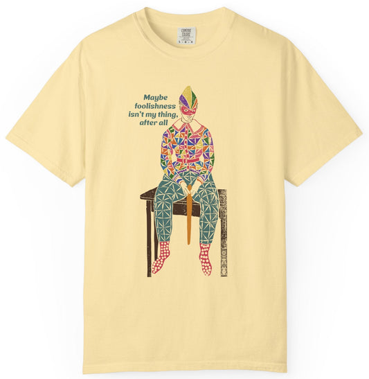 T-shirt with text and a graphic of a clownish character.