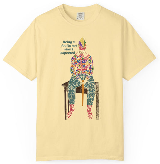 Yellow t-shirt with a colorful graphic and text on a white background