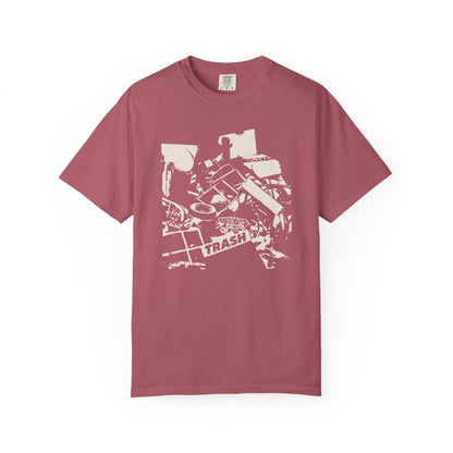 T-shirt with graphic junk pile with text "TRASH" on a piece of junk.
