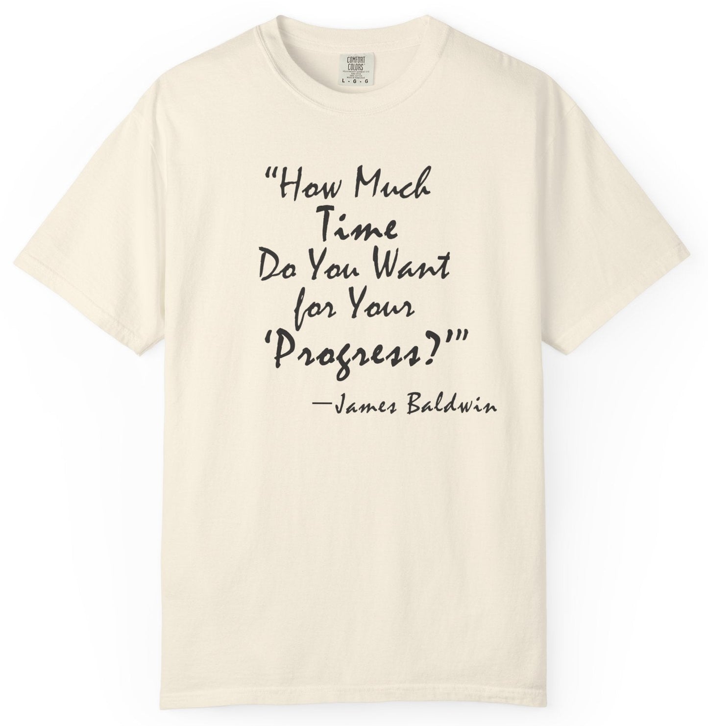 Beige t-shirt with black text quote by James Baldwin on a white background