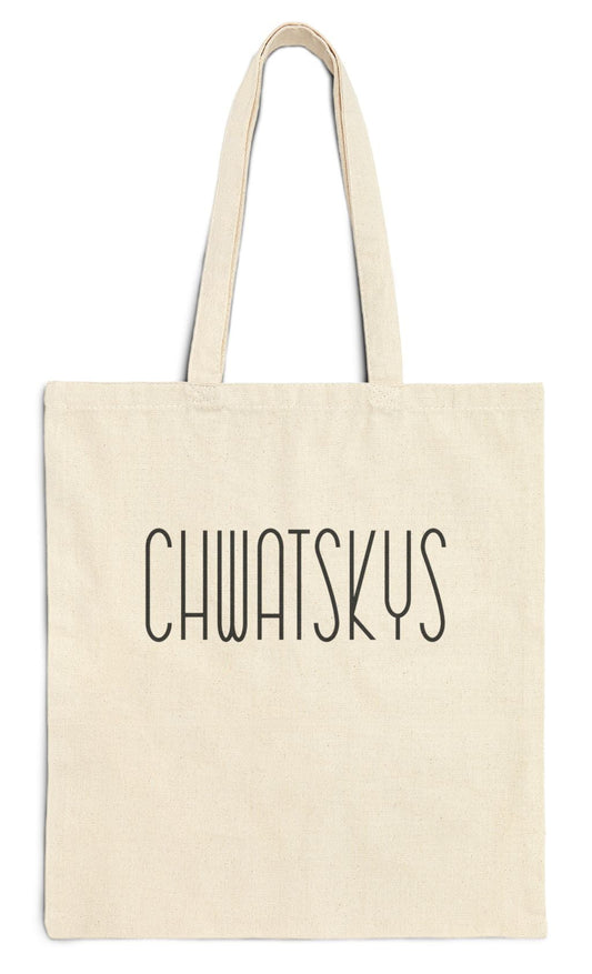 Beige tote bag with 'CHWATSKYS' text on a white background
