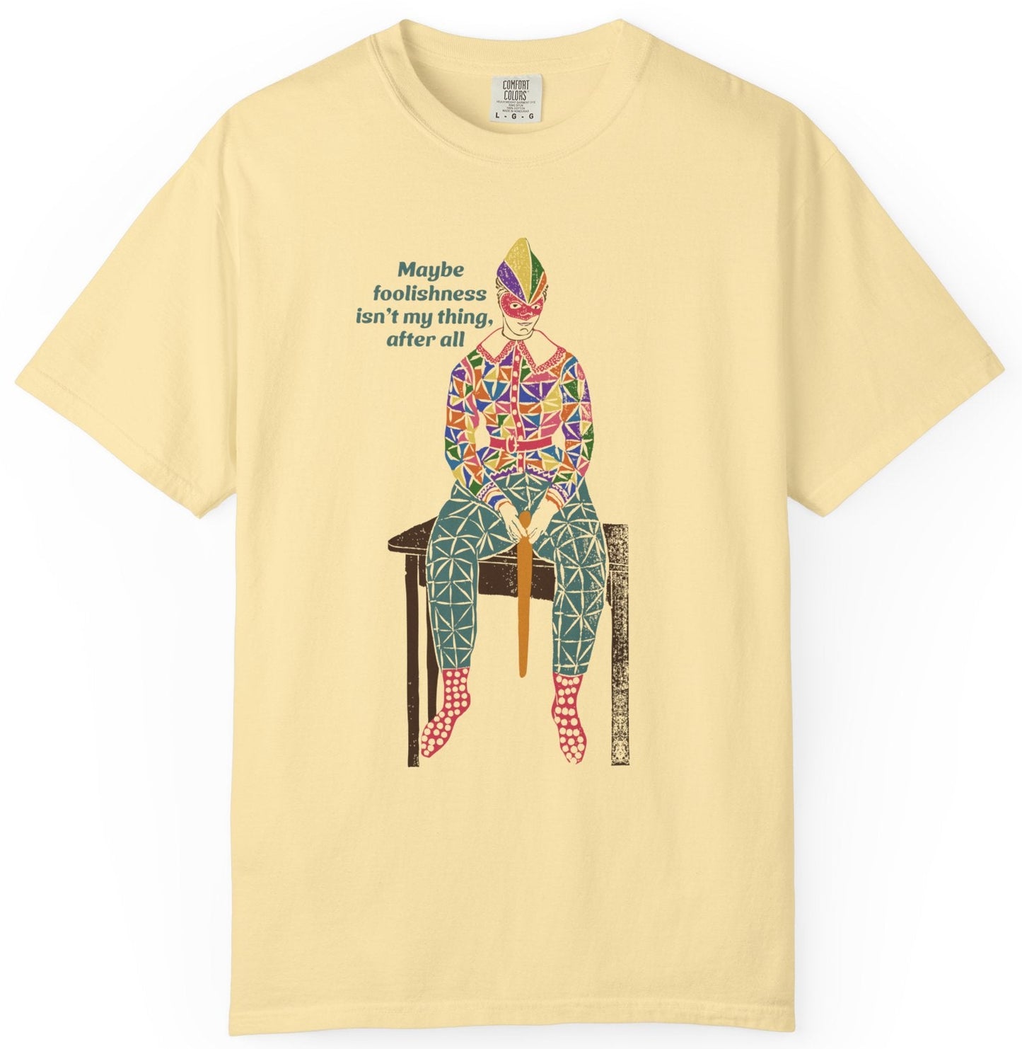 T-shirt with text and a graphic of a clownish character.