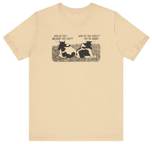 Beige t-shirt with graphic design of cows and funny text 