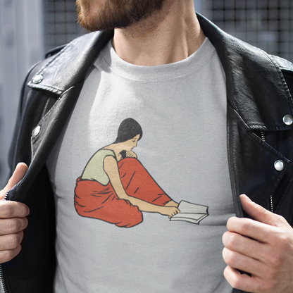 T-shirt of a graphic of  woman reading a book on the floor.