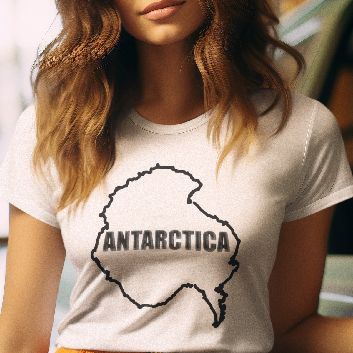 T-shirt with map of Antarctica and text 'ANTARCTICA' in snowy style lettering.