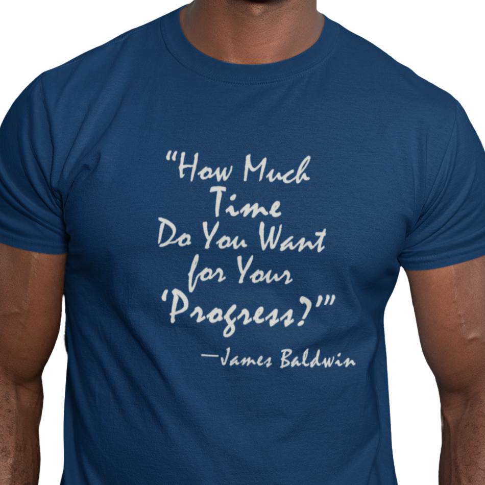 Blue t-shirt with white text quote by James Baldwin on a white background
