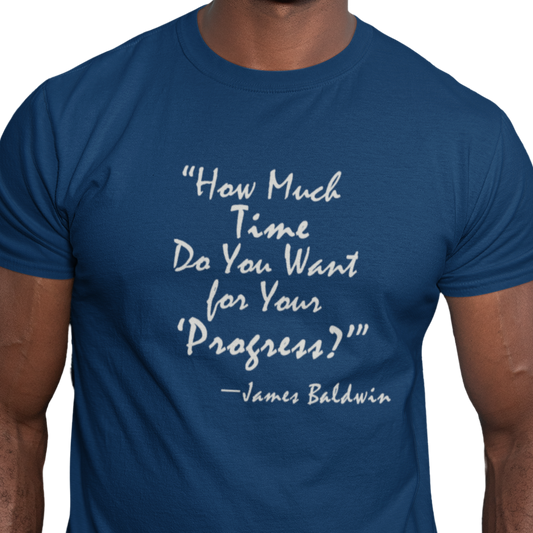 Blue t-shirt with white text quote by James Baldwin on a white background