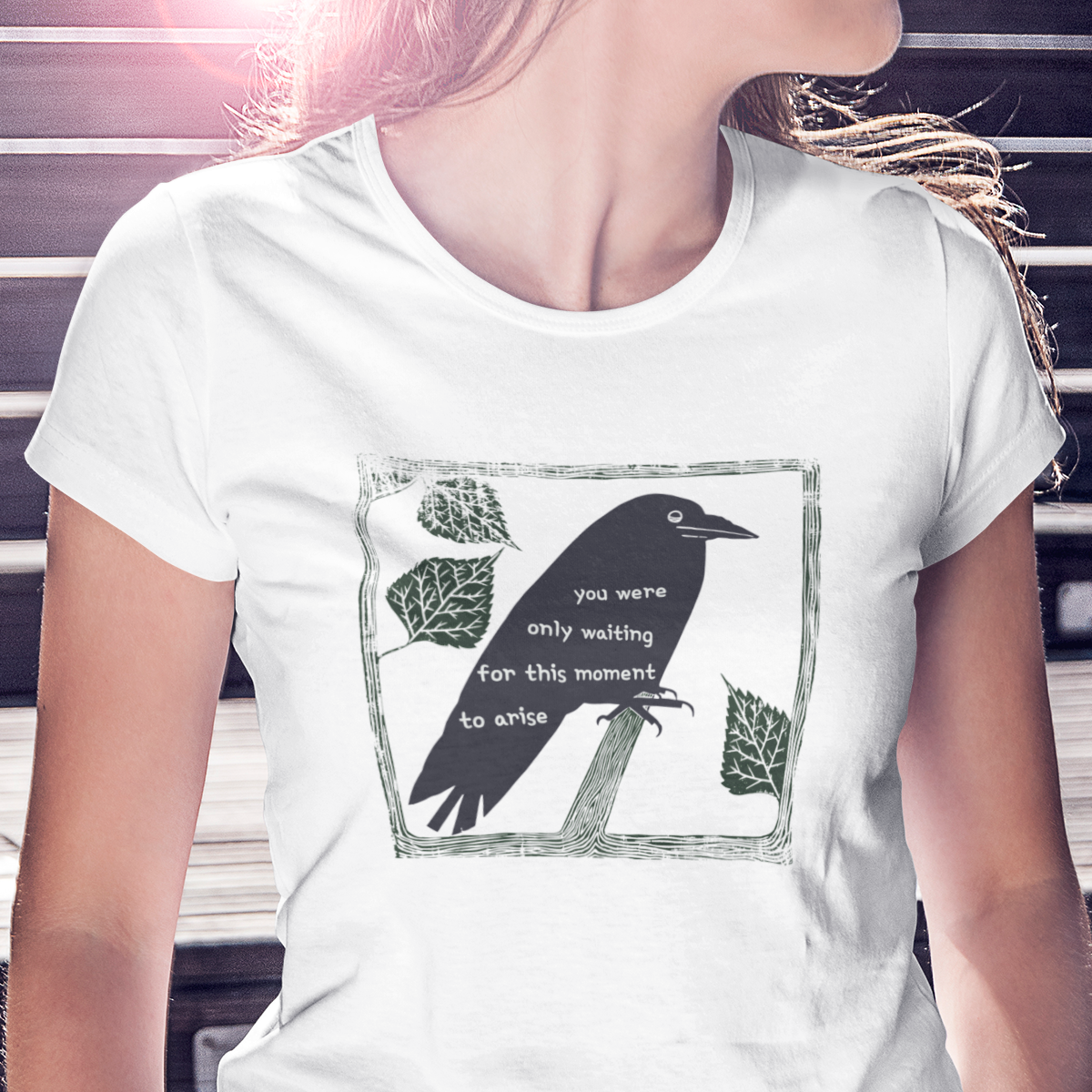 T-shirt with graphic of a black bird on a perch with Beatles lyrics text on it's body.