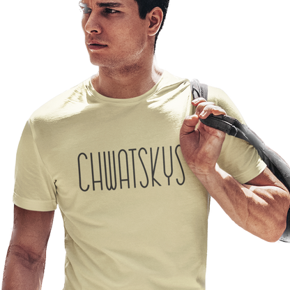Man wearing a light yellow t-shirt with 'CHWATSKYS' text, holding a bag.