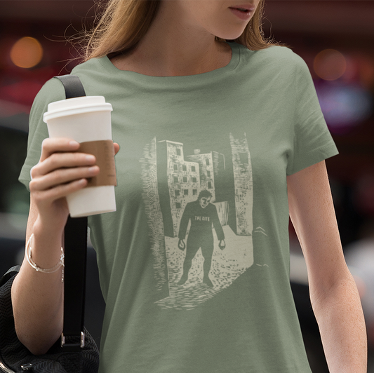 T-shirt with a graphic image of a man in a city.