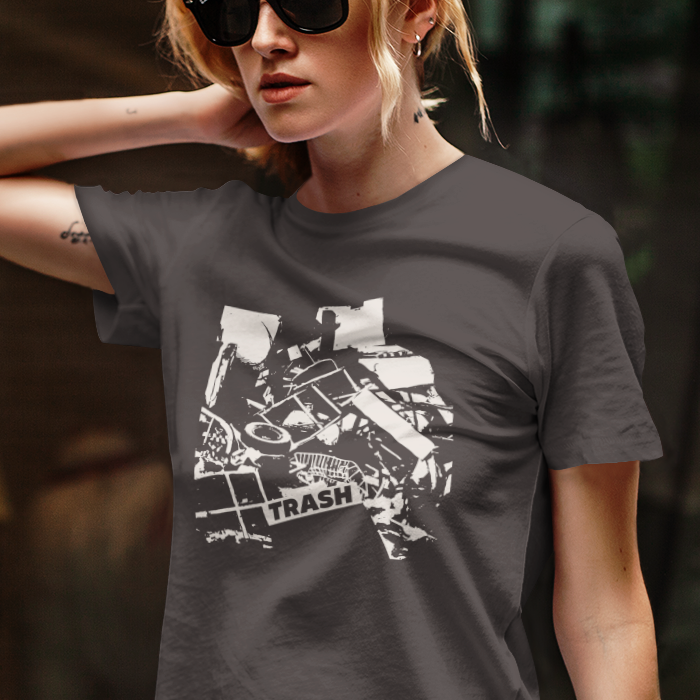 T-shirt with graphic junk pile with text "TRASH" on a piece of junk.